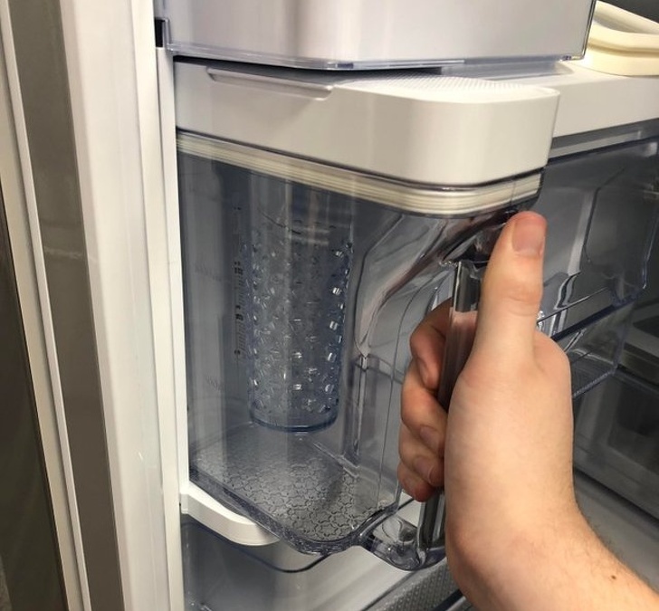 This refrigerator has an automatic water pitcher built into it.