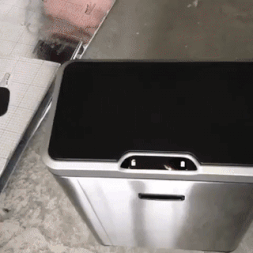 A touchless garbage can with sensors