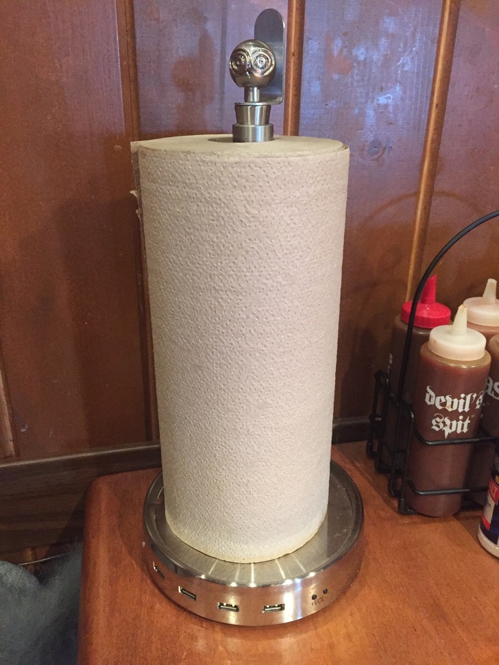 This paper towel holder has USB charging ports.