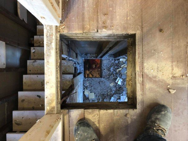 View into a basement after chimney removal.