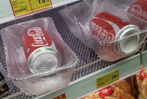 extra packaging coke can in plastic - " . 24.