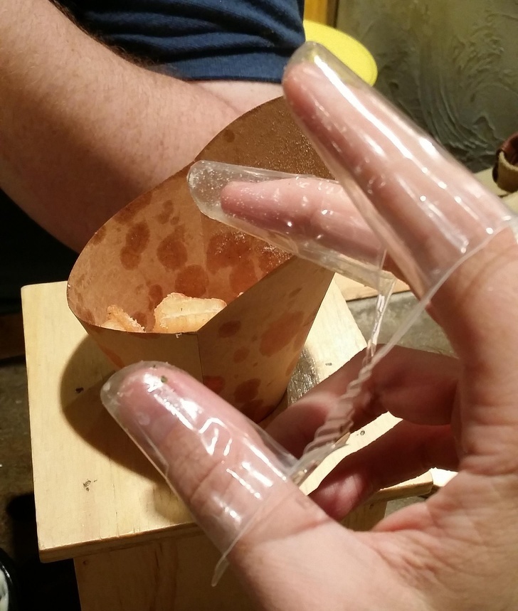 Plastic finger covers to eat chips with (South Korea)