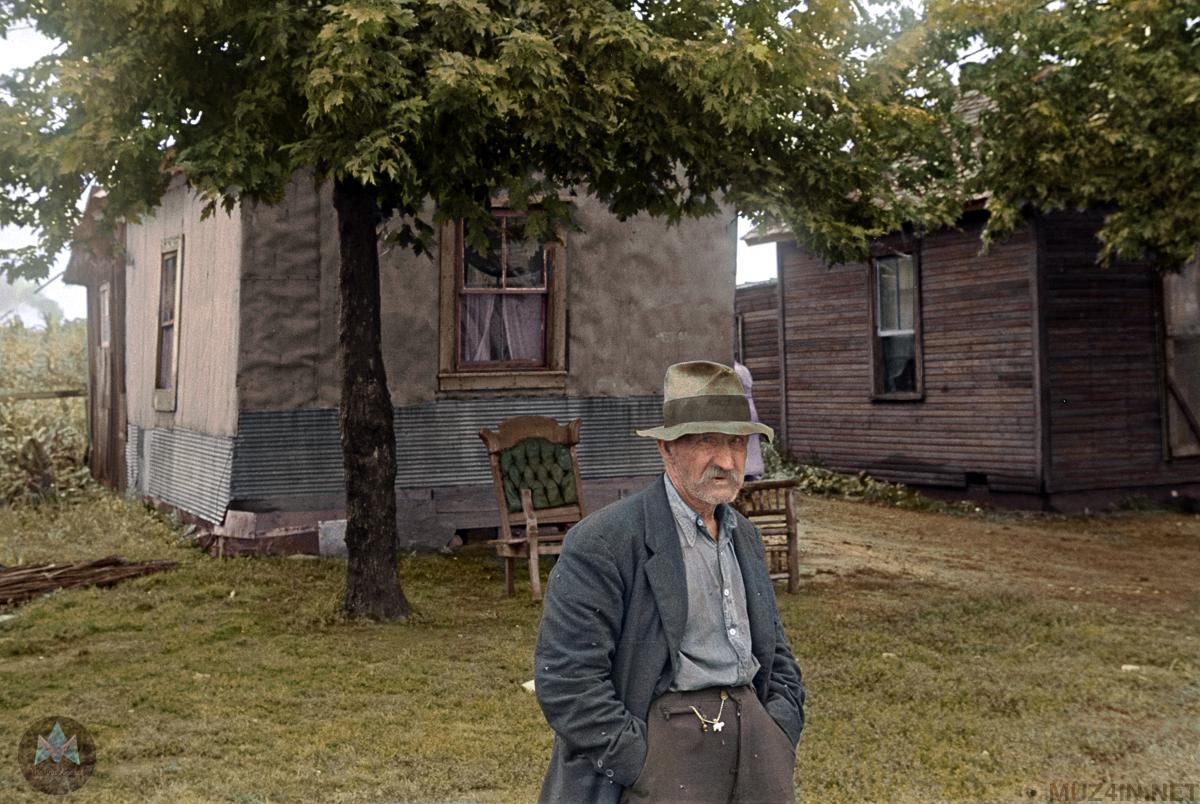 A Great Depression Era farmer outside his home.