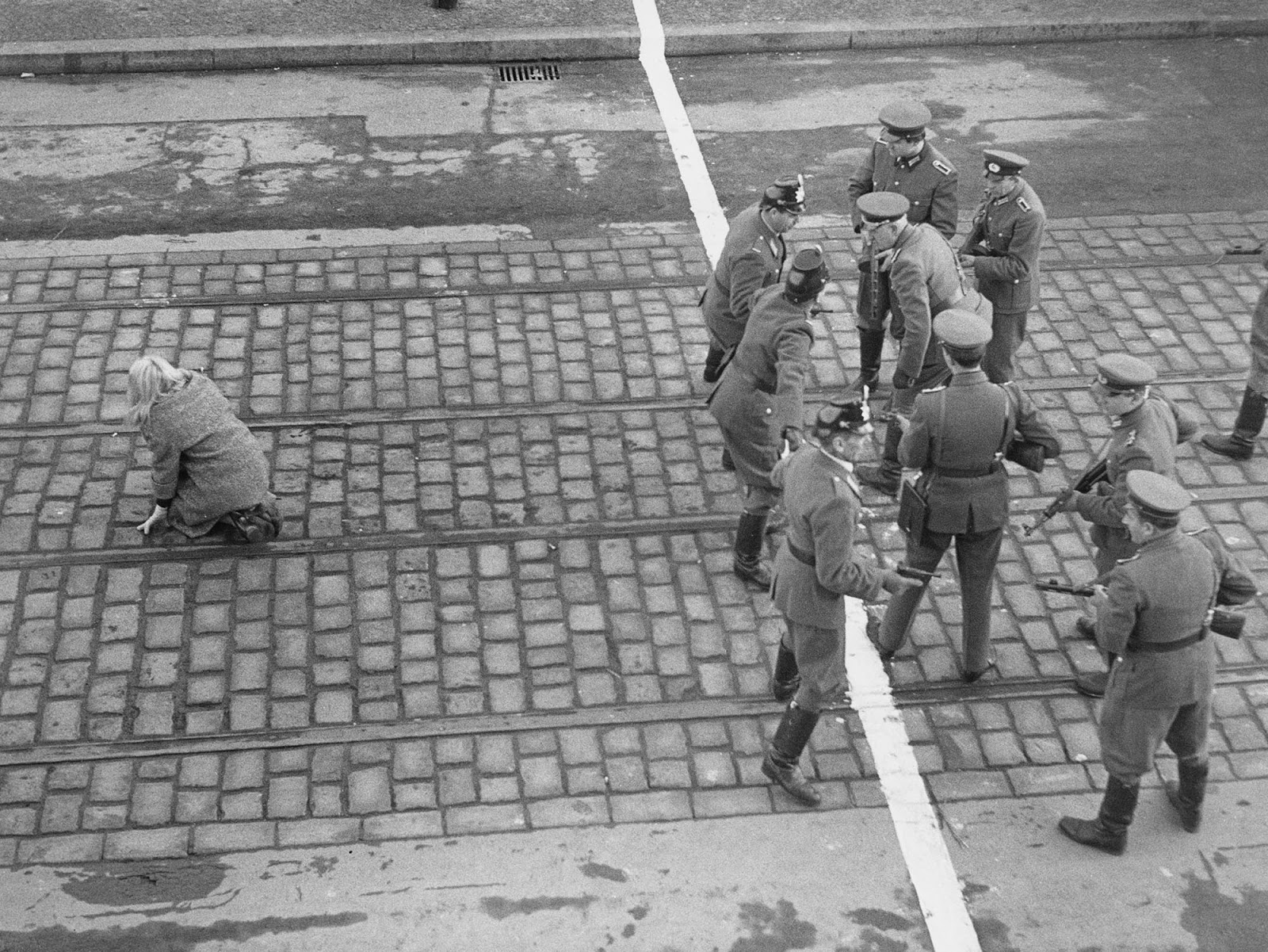 East German and West German border guards have a stand off after an East German woman crossed the boundary into West Berlin.