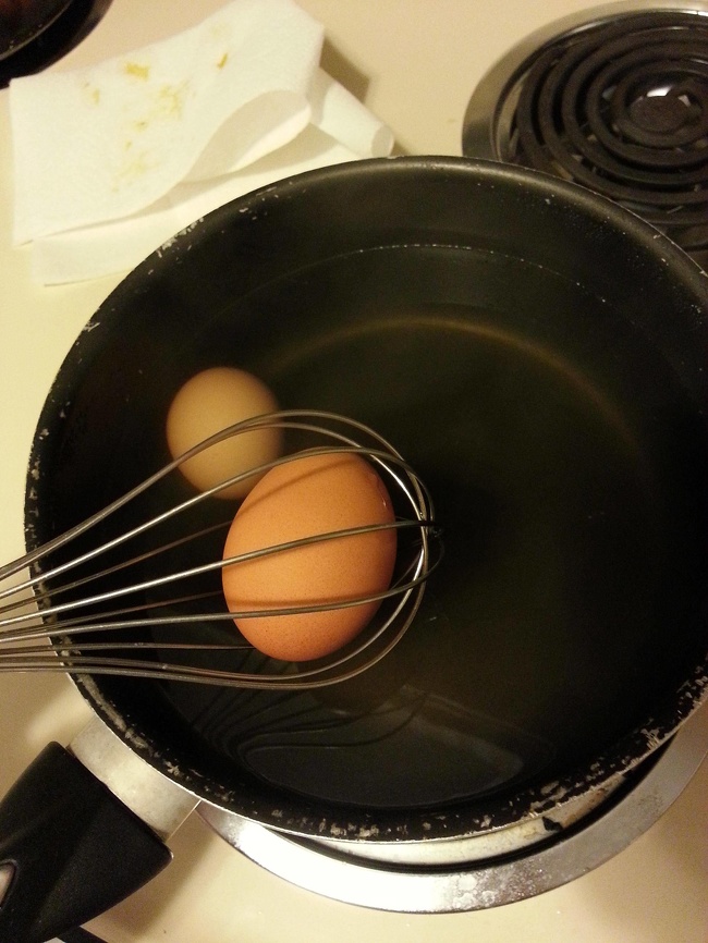 Use a whisk to easily remove a hard-boiled egg.