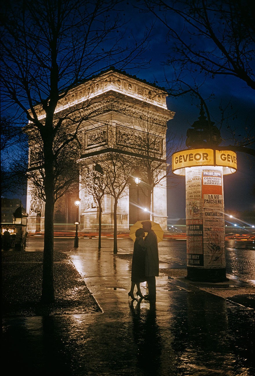From National Geographic -  Lovers Share Heartfelt Embrace In The Rain Next To The Arc De Triomphe In Paris, 1960.