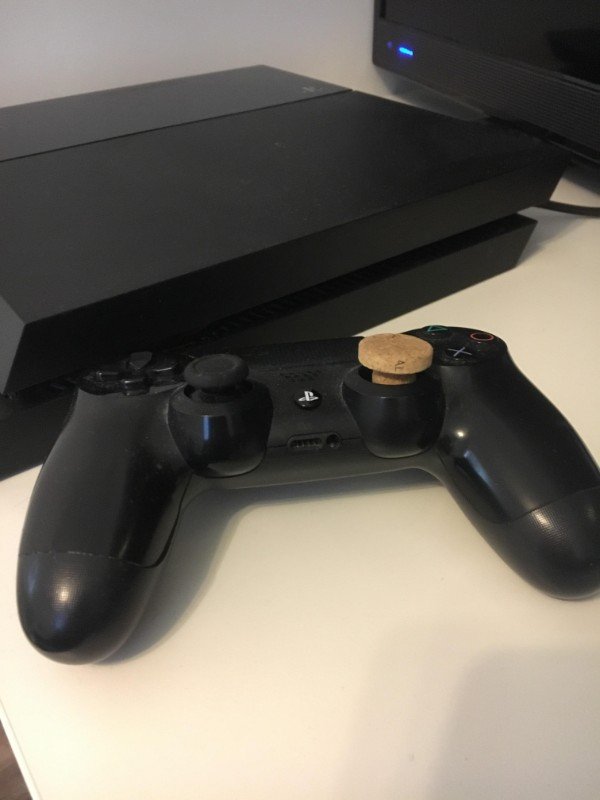 This person used a cork to replace a broken joystick.