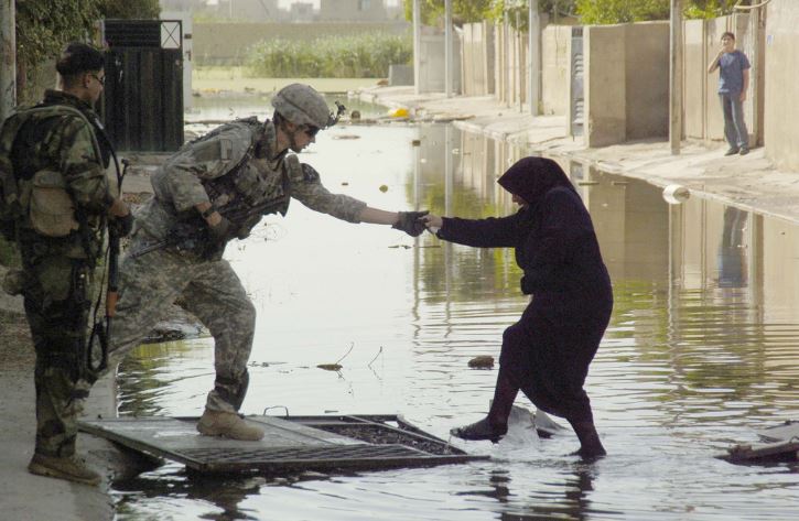 soldiers helping others