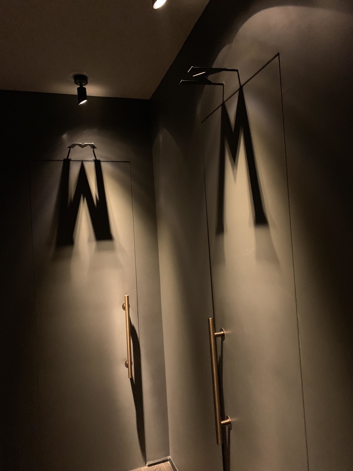 This restaurant uses shadows to show the men’s and women’s restrooms.