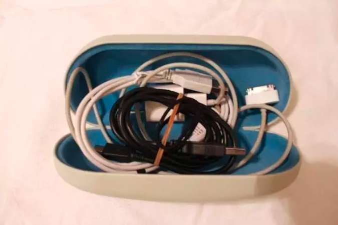 Use a sunglasses case to keep all of your cords so they don’t get tangled in your stuff.