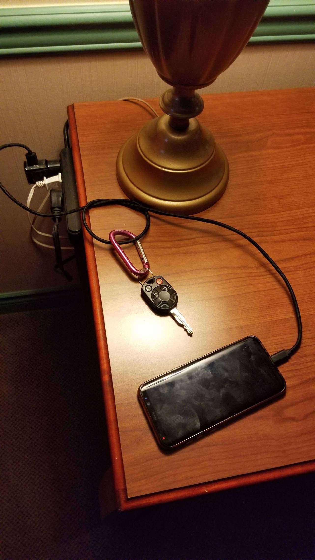 Attach your keys to your phone charger so you don’t forget it when you leave the hotel.
