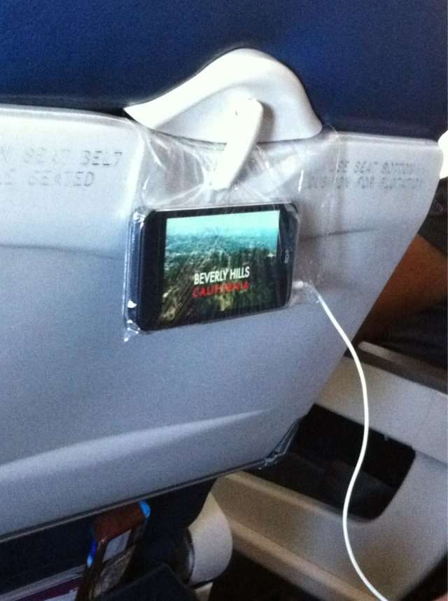 If you don’t have your computer, stick your phone in a plastic bag and hang it from the seat to watch a movie.