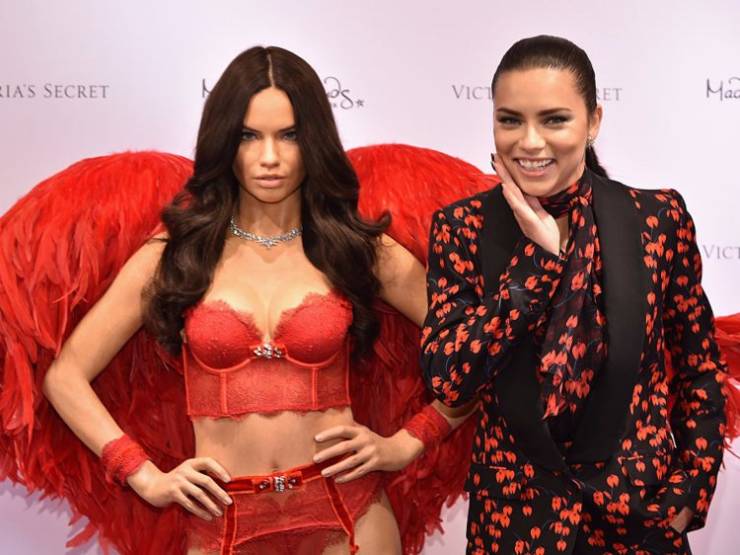 Victoria's Secret Angel Adriana Lima was giggly next to her wax figure.