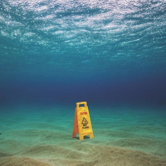 caution sign under water