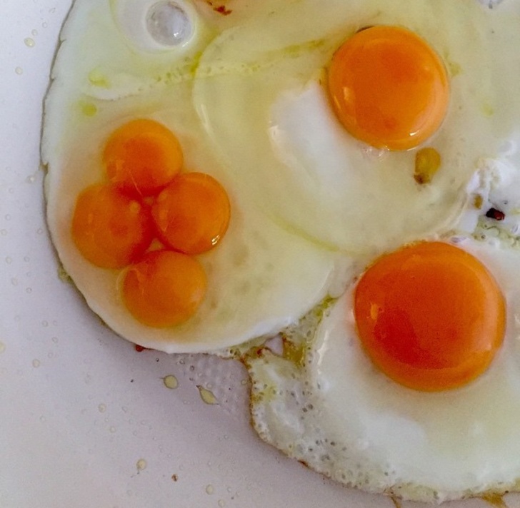 A quad-yolker? Maybe it brings good luck, like a yellow four-leaf clover.