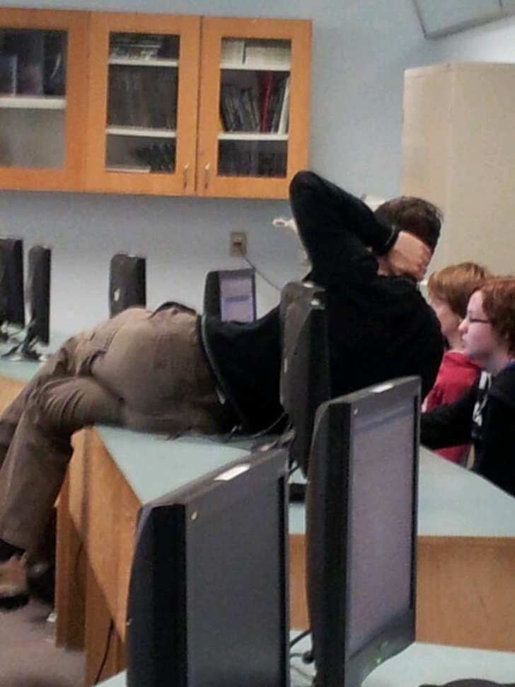 teacher leaning over