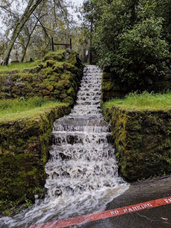 The water is pouring down these steps.