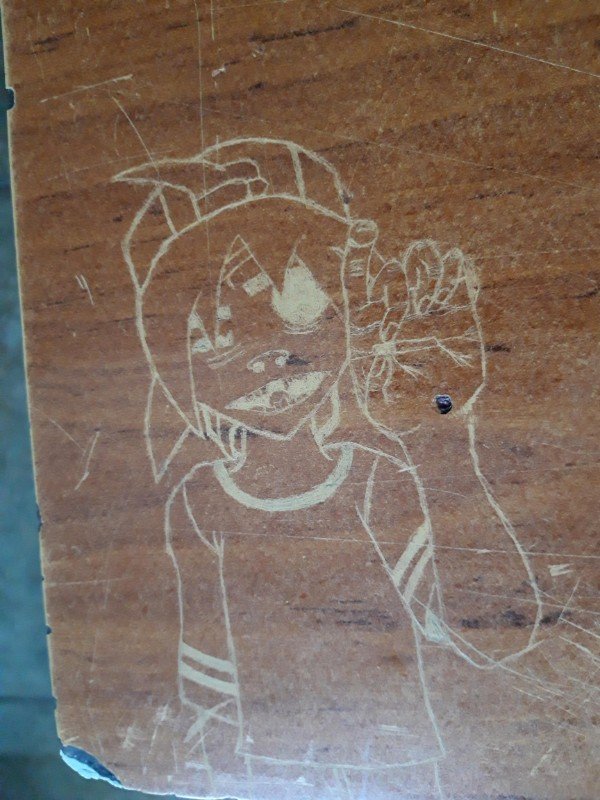 gorillaz carved in a desk