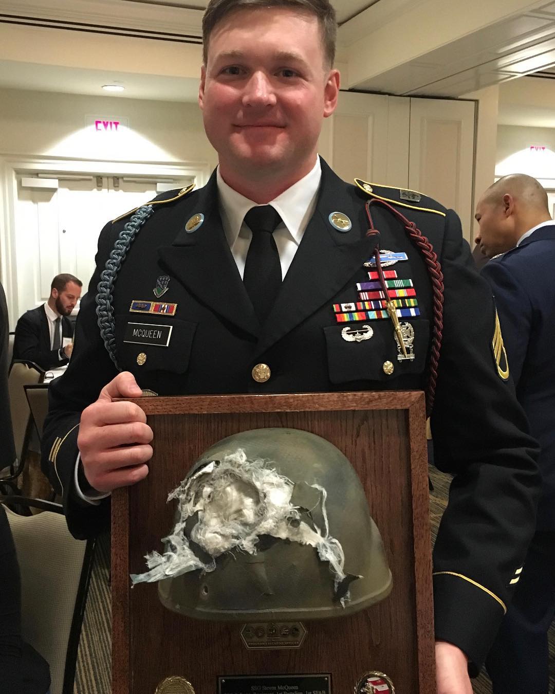 Solider receives his mounted helmet that took a 7.62 round at 20′ while wearing it.