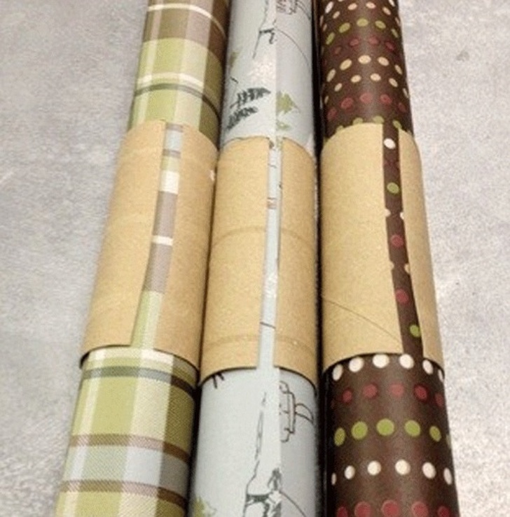 Put a cardboard roll around wrapping paper to keep it together.