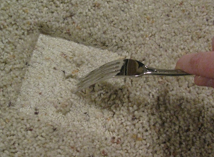 A fork will help fluff crushed carped left by furniture.