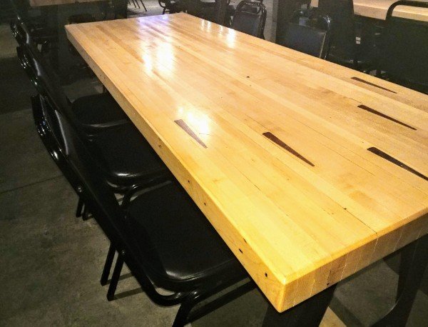 Dining table made from an old bowling lane.