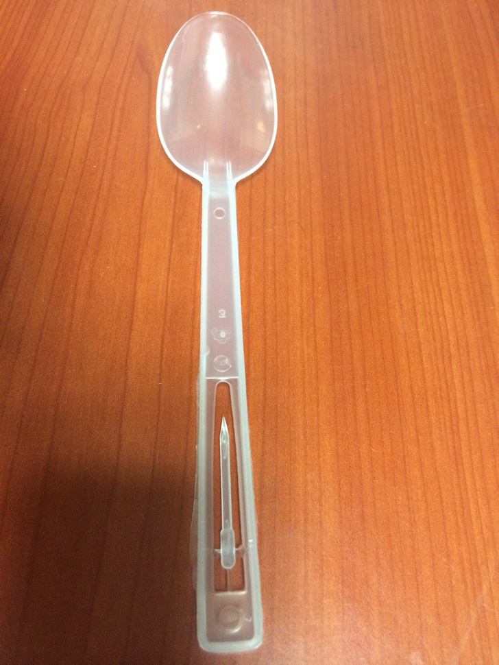 This plastic spoon has a built-in toothpick.