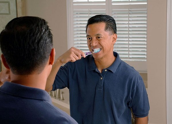 Brushing your teeth, especially if you do it too hard, can actually be damaging.