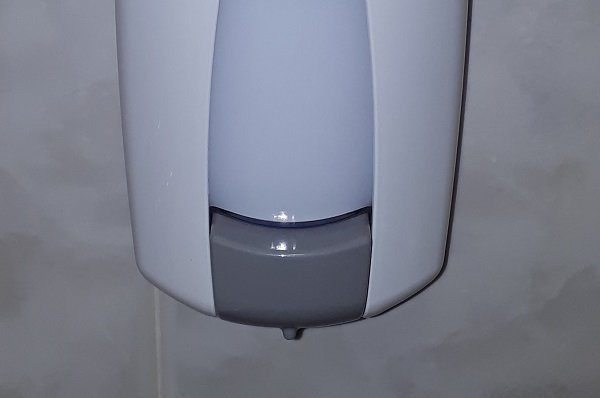 Public bathroom soap dispensers are often seldom cleaned and are crawling with bacteria.