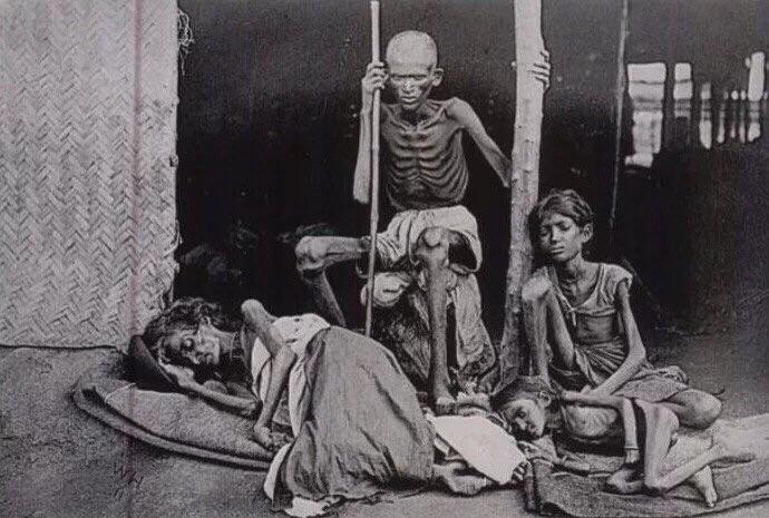 A man guards his family from the cannibals during The Madras famine of 1877.