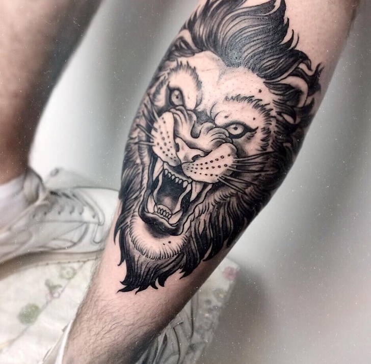Growling lion tattoo