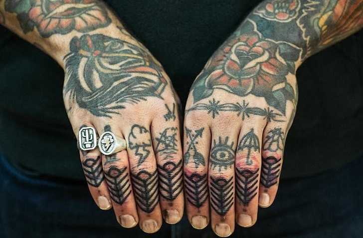 Heavily tattooed hands