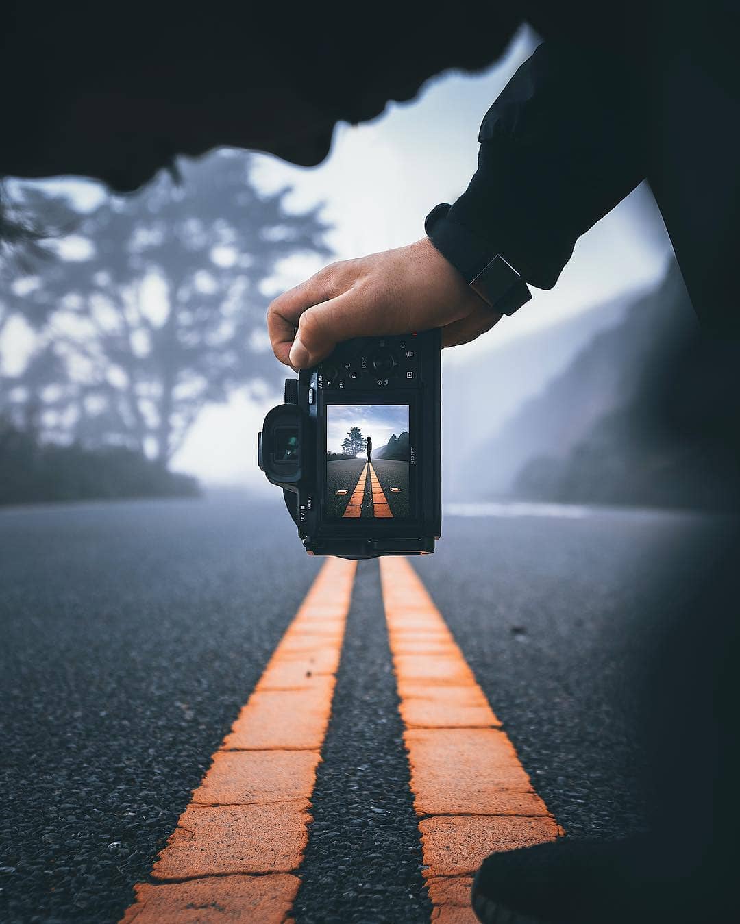 Beautiful photo of a guy taking a photo of a road