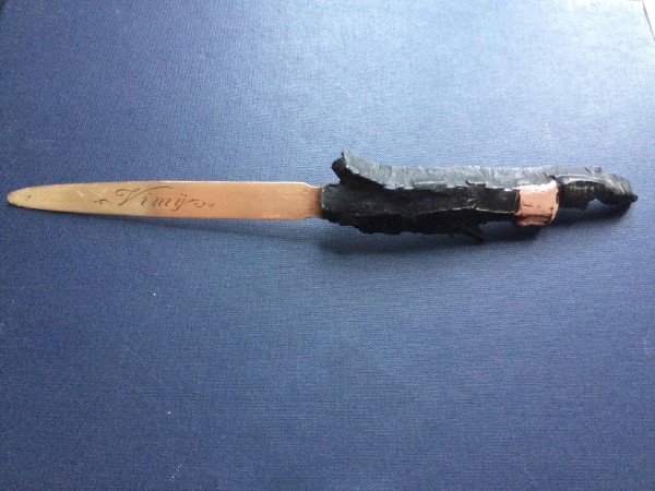 Letter opener made from grenade shrapnel.