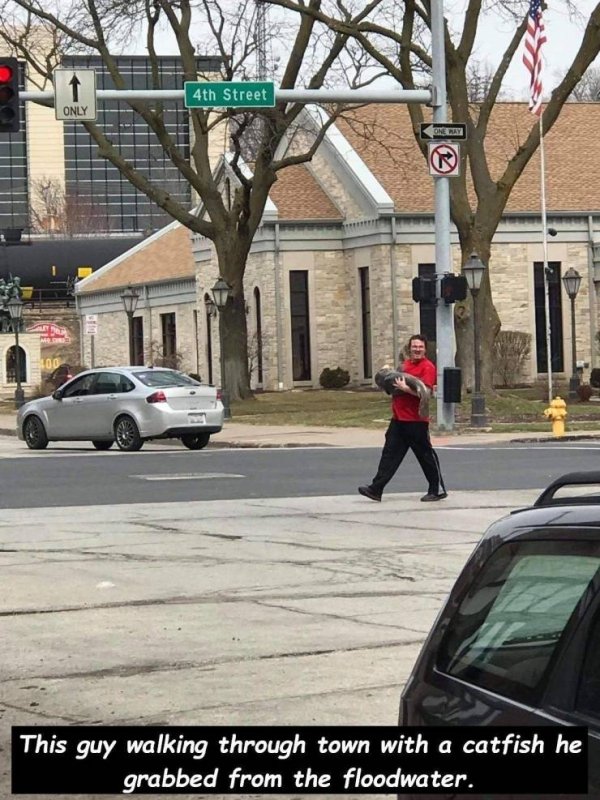 davenport catfish guy - 4th Street Only This guy walking through town with a catfish he grabbed from the floodwater.