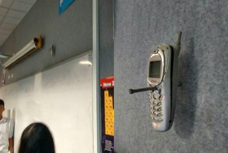 Phone nailed to the wall 20 years ago.