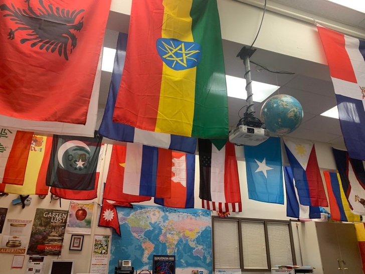 Teacher hangs flags for each country her students are from.