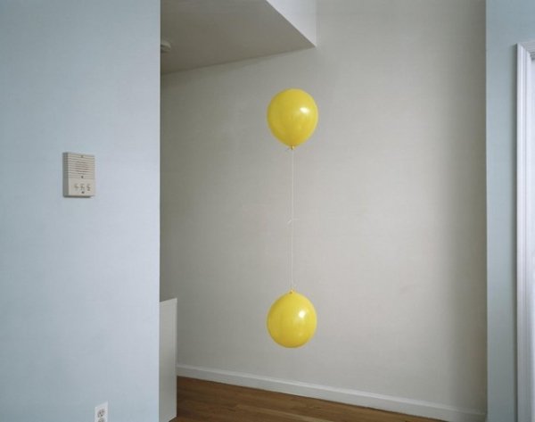 Helium balloon and non-helium balloon cancel each other out.