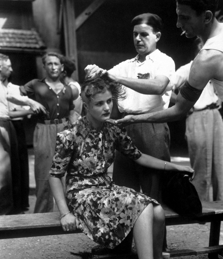 French woman has her head shaved for sleeping with a Nazi, 1944.