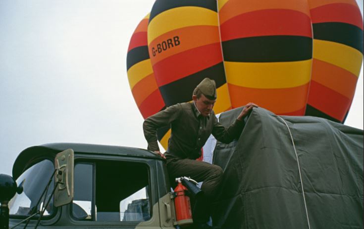 Soldier rushing to help a hot air balloon, 1990.