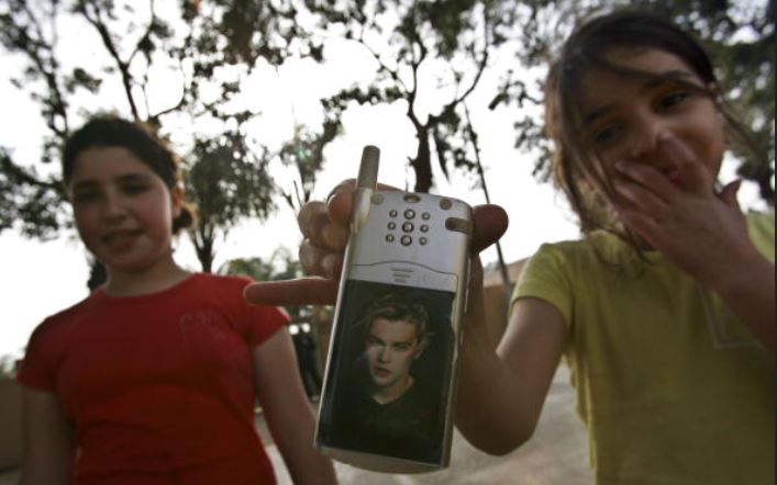 Israeli schoolgirl shows this sticker of Leonardo DiCaprio on her phone, 2007.