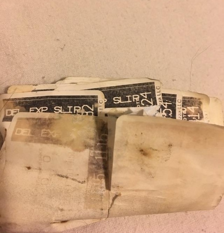 A Domino's driver bought a new car and found a wad of delivery tags in it. The previous owner was also a Domino's driver.