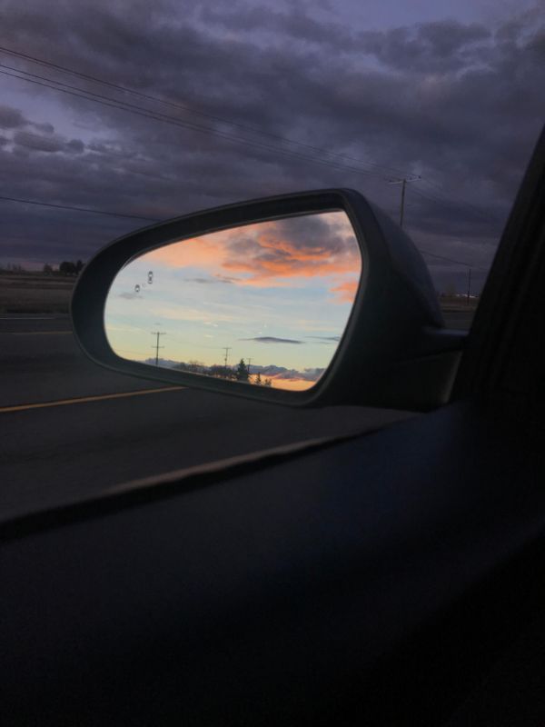 Clouds are lit in the reflection.