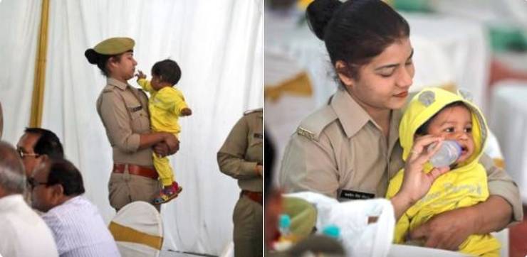 Mother takes care of her child while on duty.