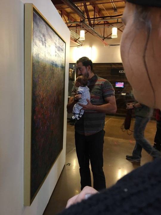 Father teaching his child to appreciate art.