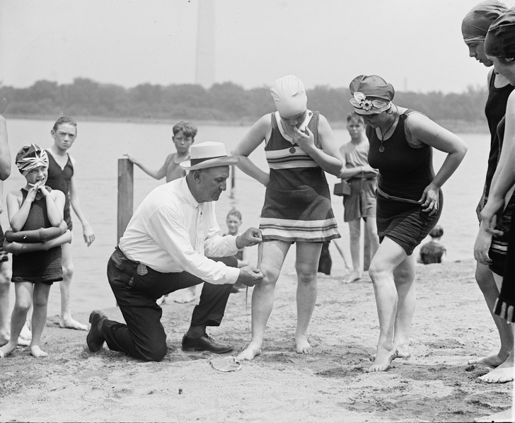 Checking the length of a swimsuit, 1922.