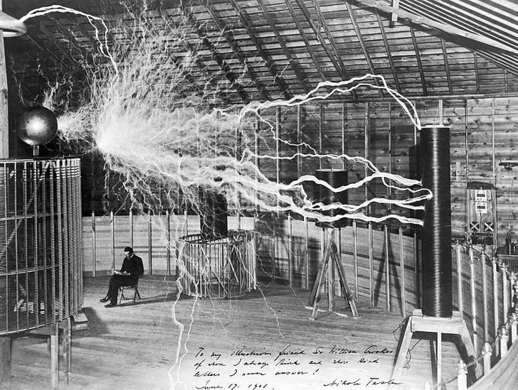 Nikola Tesla in his laboratory, 1899.