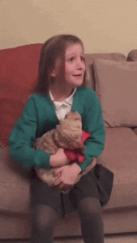 gifs - reverse gif little girl gets a dog