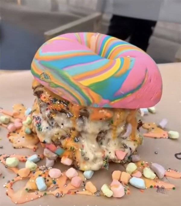 Food monstrosities of a rainbow bagel filled with marshmallows