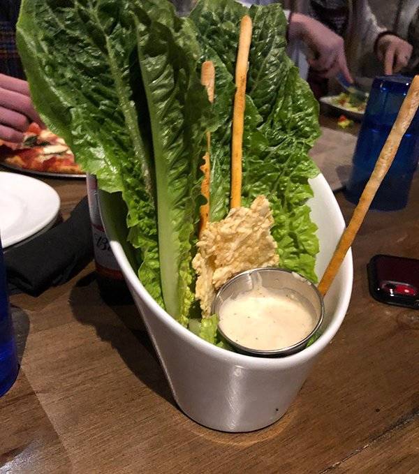 Food monstrosities of a huge piece of lettuce served at a restaurant